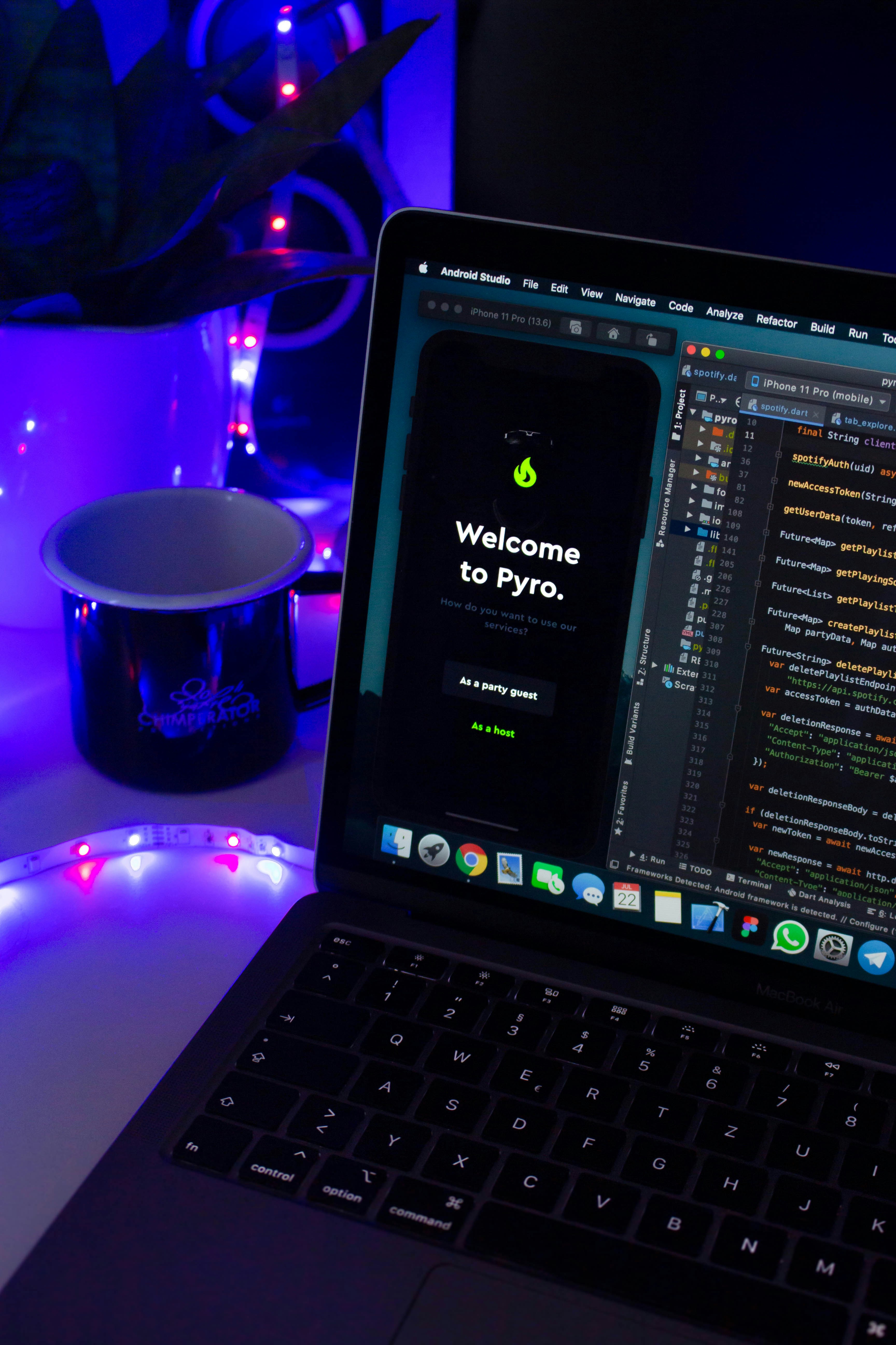 Laptop running development software with neon ambient light — symbolizing innovation and performance at Vista Luxe Media.